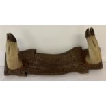 A vintage Taxidermy deer foot, wall mounting coat/hat hook.