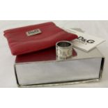 A Dolce & Gabbana band style dress ring with original box, red leather effect pouch.