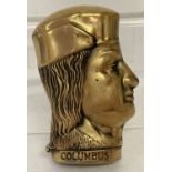 A novelty brass vesta case in the shape of Columbus.