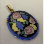 A floral painted ceramic panel pendant with 18ct gold fixing mount and bale.