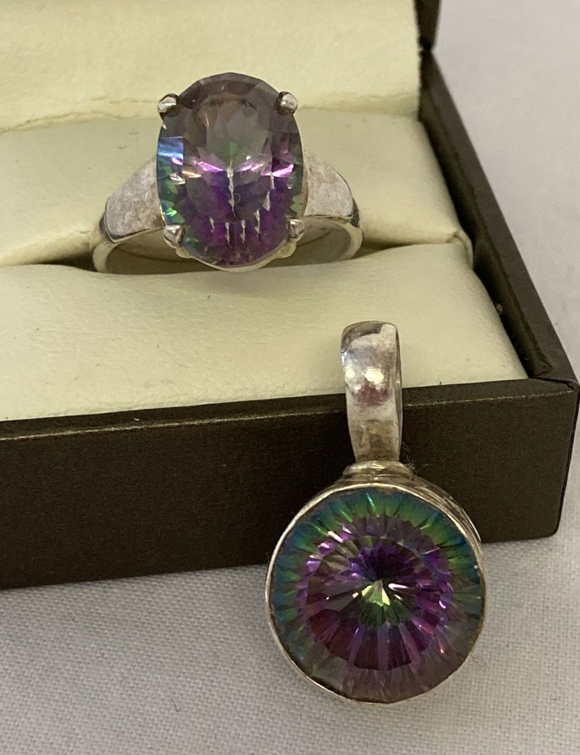 2 pieces of 925 silver and mystic topaz set jewellery.