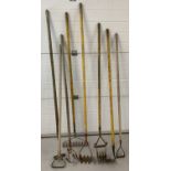 A collection of 8 vintage long handled garden tools.