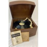 A vintage wooden cased "The Black Box" record player by Pye with Garrard automatic record changer.