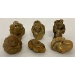 6 small carved oriental figures.