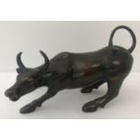 A hollow bronze figurine of a bull.