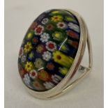 A 925 silver dress ring set with large oval shaped piece of Millefiori glass.