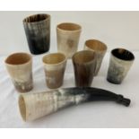 A box of vintage natural horn beakers and blowing horn.
