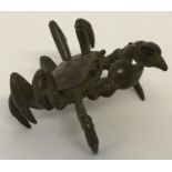 A small Chinese bronze figure of a crab, signed to underside.