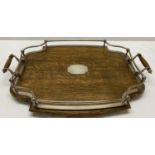 An Edwardian oak and Walker & Hall silver plated gallery tray with capstan style supports.