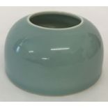 A Chinese porcelain brush washer with duck egg blue glaze.