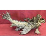 A bronze figurine of a Chinese Dragon fish.