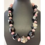 A natural stone statement necklace by Butler & Wilson.