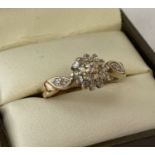 A 9ct gold .25 diamond cluster style dress ring. Full hallmarks to inside of band.