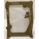 A vintage brass Art Nouveau style, freestanding brass picture frame with black baize to reverse.