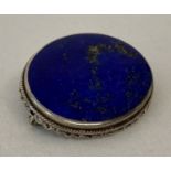A vintage silver and lapis lazuli brooch. Fine bead and rope design to outside edge of mount.