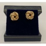 A pair of 9ct gold twisted knot style stud earrings, fully hallmarked on posts.