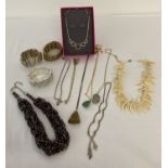 A collection of vintage and modern costume jewellery necklaces and bracelets.