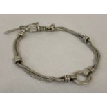 A decorative silver rope chain bracelet with ring detail. Lobster style claps with t bar.