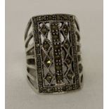 An Art Deco style silver and marcasite cocktail ring.