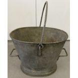 A vintage galvanised pail with carry handle and two side handles.