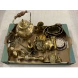 A collection of brass & silver plate items to include a kettle, small planters & wooden handled bell