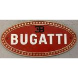 A cast iron oval shaped "Bugatti" wall plaque.