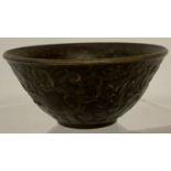 A small Chinese bronze bowl with elephant detail to outer bowl.