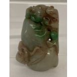 A carved Chinese jade pendant.