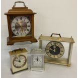 4 vintage wooden and metal cased mantle and carriage clocks. To include Metamec and Seiko.
