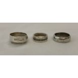 3 silver band rings to include designs by Paul Magen and Thomas Sabo.