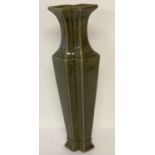 A tall slim dark green glaze vase of double diamond shape, with engraved signature to base.