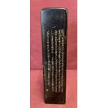 A slim square shape black soap stone seal with engraved calligraphy detail to one side.