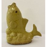 A Chinese porcelain water dropper, in the shape of a fish, with yellow glaze.
