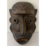 An African carved Tribal mask.