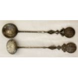 2 Chinese white metal spoons with deity figures to handles and bamboo design to stems.