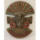 A red and green painted pottery Mayan mask.