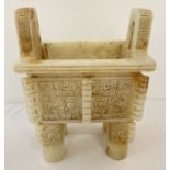 A large rectangular shaped, 4 footed, carved white jade censer.