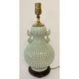 A 2 handled celadon glazed ceramic lamp base of classical design with fluted detail.