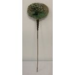 A vintage decorative pierced work, jade hair pin, depicting birds in a bonsai tree.