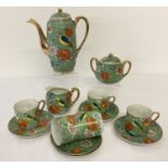 A vintage Japanese 13 piece coffee set with floral and bird detail.