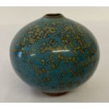 A green speckled glazed Chinese ceramic water dropper of bulbous form.