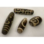 4 Tibetan dzi agate beads.