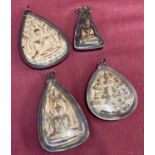 4 metal and plastic encased Oriental Icons made into pendants.