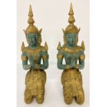 A pair of gilt and green painted heavy brass kneeling Thai figurines.