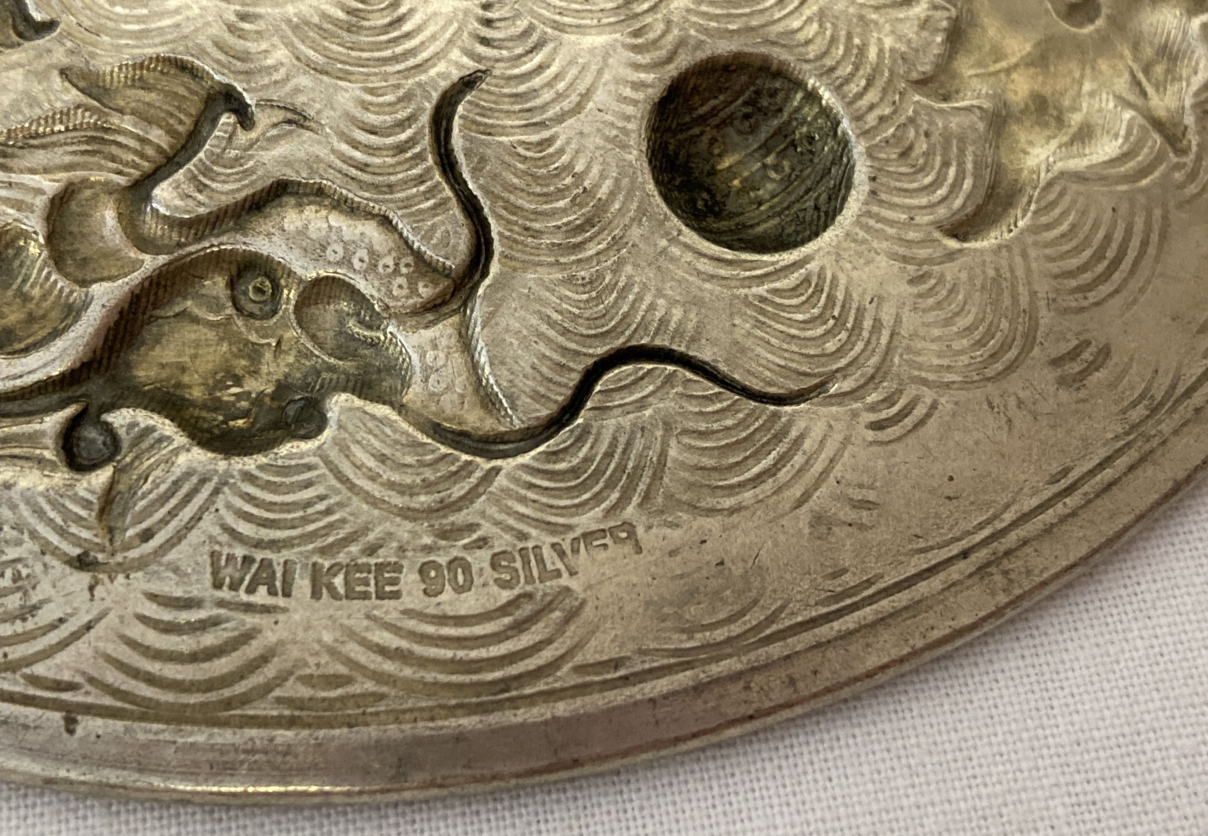 A Chinese white metal coin dish, made from central coin with white metal surround featuring dragons. - Image 3 of 3