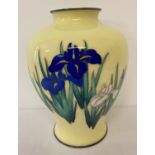 A yellow cloisonné vase of bulbous form with silver base and top rim and iris flower detail.