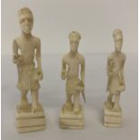 3 carved bone figures of African tribesmen.