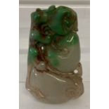 A carved Chinese jade pendant.