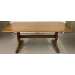 A vintage elm wood Ercol refectory style coffee table.