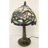 A small Tiffany style table lamp with floral design leaded glass lampshade.